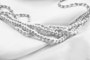 Pearl necklace on silk