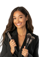 Smiling woman holding makeup brushes in both hands
