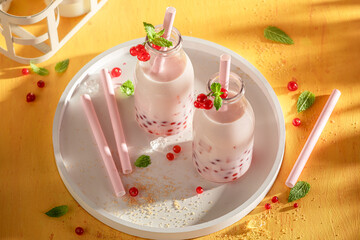 Homemade red currant bubble tea with milkshake and ice.