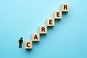 Obraz premium Career Progression Concept Wooden Blocks Spelling Career Arranged as Stairs with a Silhouette Climbing Upward on a Blue Background Representing Advancement