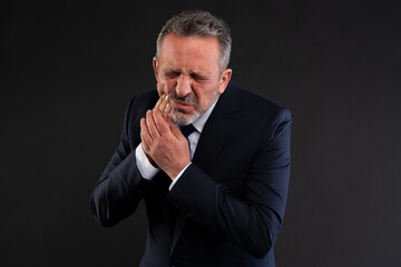 Businessman suffering from toothache