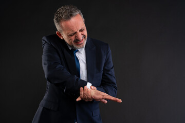 Businessman suffering from hand pain