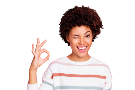 Photo of pretty dark skin lady winking eye showing okey symbol fully agree with shopping prices wear white striped pullover isolated pastel pink color background