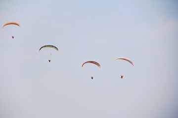 Bright colourful parachute isolated on white background. Concept of extreme sport, taking adventure...