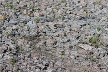 Gabion mattress made of woven mesh with stones for creating paths. Stones in the mesh, creating...