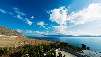 The landscape along the road to Balos Lagoon is wild and dramatic, with rocky hills, dry...