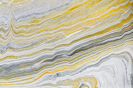 Abstract acrylic paint background in yellow and gray tones