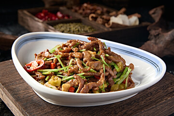 Chinese food Hunan style stir-fried beef tenderloin with pickled pepper and coriander