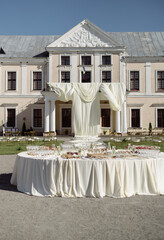 Outdoor Banquet with Fresh Fruits and Castle View
