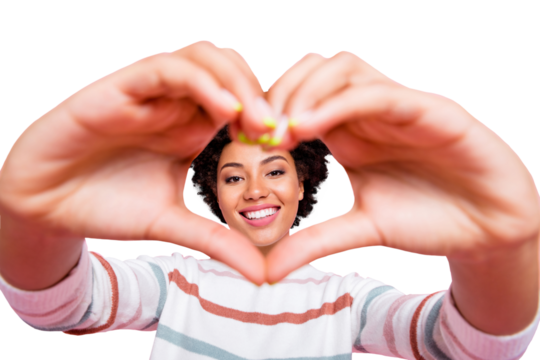 Photo of pretty dark skin lady making fingers heart form holding face inside it in cadre wear striped pullover isolated pastel pink color background