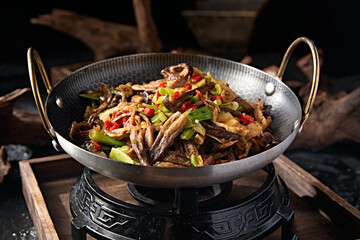 Chinese food: pork belly with pepper and garlic sprouts, tea tree mushroom