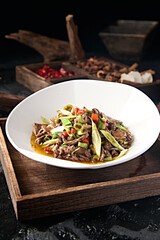 Sichuan style stir-fried pork liver with rice pepper and garlic sprouts