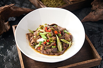 Sichuan style stir-fried pork liver with rice pepper and garlic sprouts