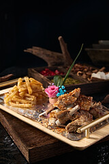 Mongolian delicious charcoal grilled lamb ribs with French fries