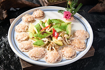 Chinese Cantonese cuisine Zucchini, white mushroom, lotus root slices, fried water chestnut and shrimp cakes