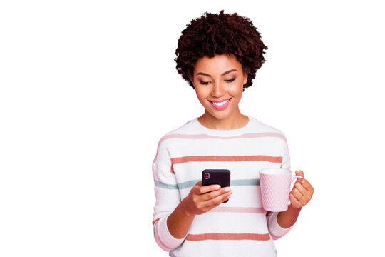 Photo of trendy stylish curly wavy nice cute charming sweet pretty youngster using modern technologies to know new information holding wear white striped sweater isolated pastel color background