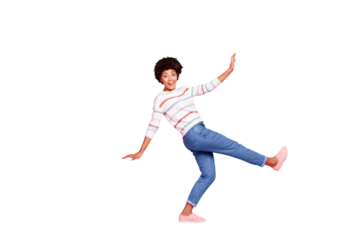 Full body profile photo of pretty dark skin lady at dancing class learning new modern moves wear striped pullover and jeans isolated pastel pink color background