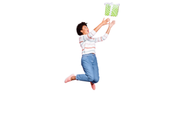 Full length body size photo of jumping pretty childish youngster stretching to receive gift box in jeans denim striped sweater with excited facial expression isolated pastel color background