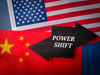 Us and china flag with the word POWER SHIFT on a black wooden errow