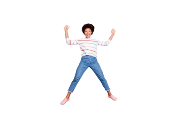 Full length body size photo of ecstatic overjoyed beautiful cute nice black lady rejoicing with jumping up wearing jeans denim shaping star in striped sweater isolated pastel color background