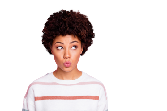 Close up photo of amazing dark skin shy lady looking empty space sending air kiss wear fluffy white striped pullover isolated pink color background