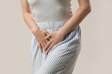 Woman having a painful stomach ache, chronic gastritis or abdomen bloating, upset stomach,...