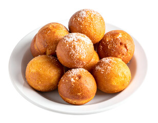 A delightful plate of golden sugar-dusted pastries promises a sweet and comforting treat.