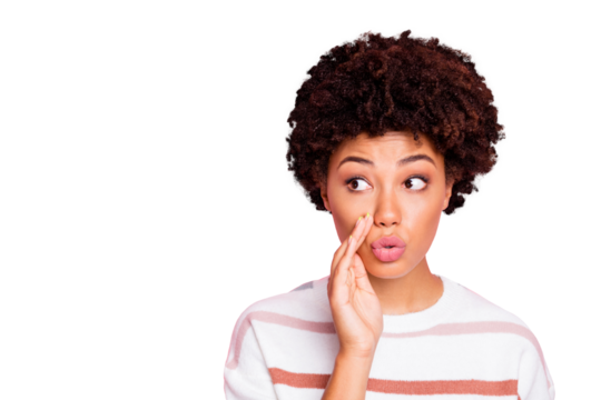 Photo of funny dark skin lady sending voice message to friend at classroom trying to avoid teacher notice it wear white striped pullover isolated pink color background