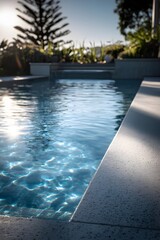 Obraz premium blue fibreglass pool, concrete terrazzo pool surround, all concrete is smooth terrazzo finish with small stones, concrete and surround is one piece, there are no tile lines