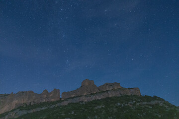 Majestic Pyrenees mountains under starlit sky in autumn