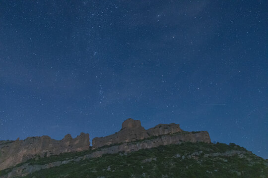 Majestic Pyrenees mountains under starlit sky in autumn