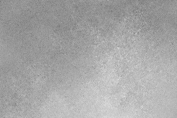 Abstract grungy texture background with different shades of gray color. Painted canvas, concrete surface, studio backdrop, grainy textured effect