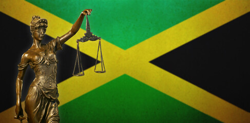 Lady Justice before a flag of Jamaica