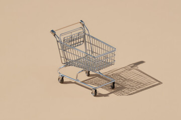 Miniature cart metal isometric pastel beige shadow empty shopping retail modern isolated creative concept minimal background simplicity design playful clean small object wheel handle basket