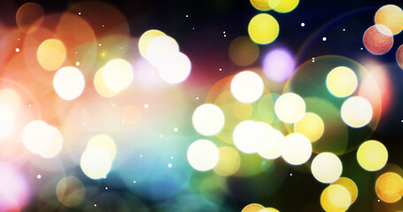Abstract view of beautiful and colorful holiday winter of outdoor blurry bokeh light with small soft snow.
