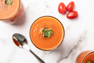Gazpacho, Spanish cold tomato soup, served in glasses.