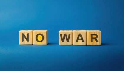 Obraz premium wooden blocks spelling no war on blue background, anti war message for social activism, peace campaign, or educational use