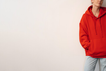 Relaxed Urban Style with Oversized Hoodie, Neutral Wall Backdrop