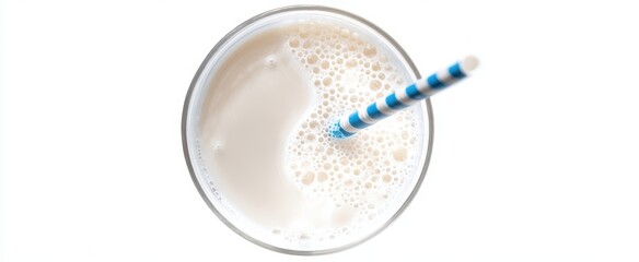 The refreshing glass of milk with a colorful straw on a white background