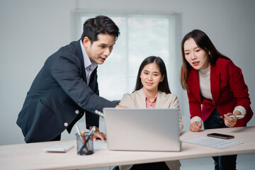 Business team collaborating in a meeting room, discussing new project strategies while a confident...