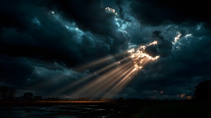 Dramatic Sunbeams Breaking Through Dark Storm Clouds Over Mountain Landscape perfect for environmental campaigns, cinematic backdrops, nature documentaries, spiritual themes weather-related content
