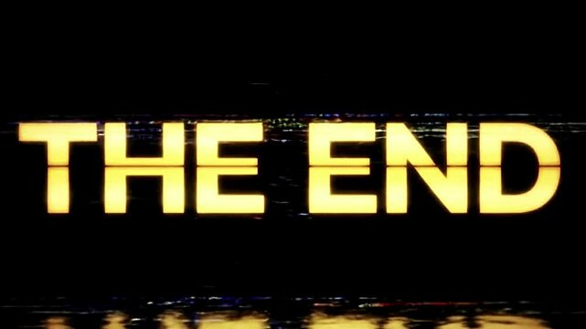 The End Text Animation with Glitch and Gold Light in Retro Console Style &ndash; Seamless Loop