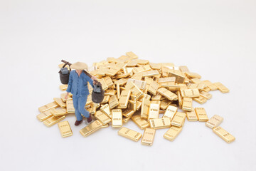 Figure Among Gold Bars Depicting Wealth and Prosperity