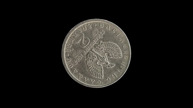Greece 1967 two drachma coin reverse with phoenix rising from flames design rotating on black background