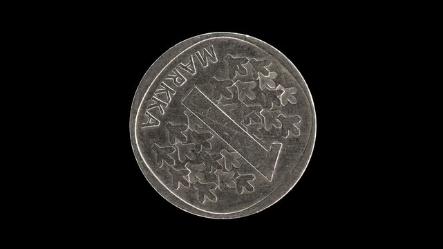 Finland 1973 1 markka coin reverse with spruce trees and large denomination rotating on black background