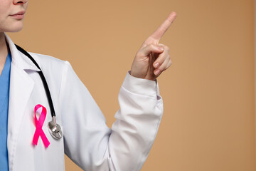 Doctor Wearing White Coat and Pink Ribbon for Awareness