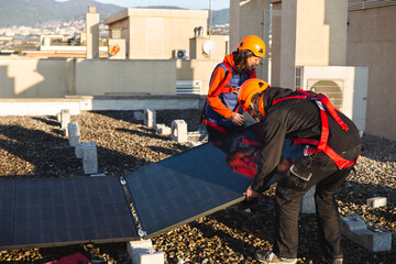 Professionals installing rooftop solar panel system