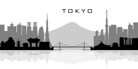 A vector silhouette of the Tokyo skyline featuring famous landmarks, modern skyscrapers, temples, and bridges reflected in the water. Black, white, and gray colors. © Елена Демчишина