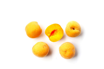 Fresh ripe apricots on a white background.