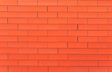 a horizantal brick wall colored orange